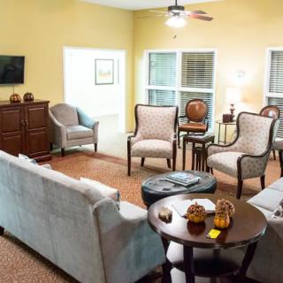 A cozy living room with comfortable seating and a warm ambiance.