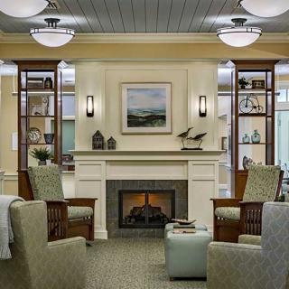 A cozy living room with a fireplace and elegant decor.