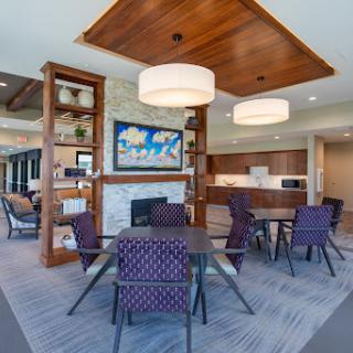 A modern lounge area featuring stylish furniture and a cozy atmosphere.