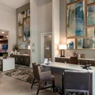 A modern office space featuring contemporary artwork and stylish furnishings.
