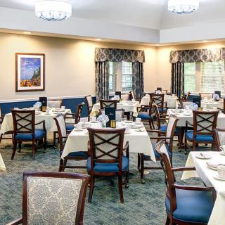 Elegant dining room with neatly arranged tables and chairs ready for guests.