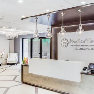 A modern and elegantly designed reception area with stylish lighting and comfortable seating.