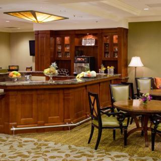 Cozy bar area with seating and warm lighting.