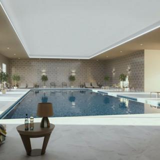 A luxurious indoor swimming pool with modern design and relaxing ambiance.