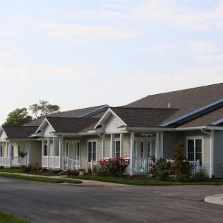 A row of charming suburban houses with well-maintained gardens.