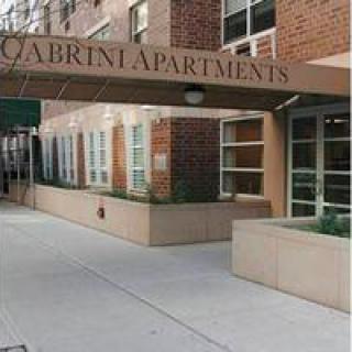 Entrance to Cabrini Apartments with a covered walkway.
