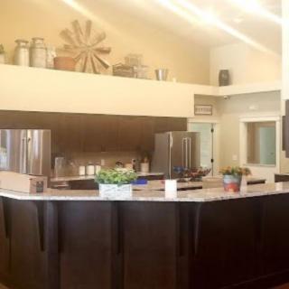 A modern kitchen interior featuring a large countertop and stylish decor.