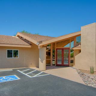 A modern building with an accessible entrance and parking.