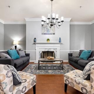 A beautifully designed living room featuring a cozy fireplace, stylish furniture, and elegant decor.