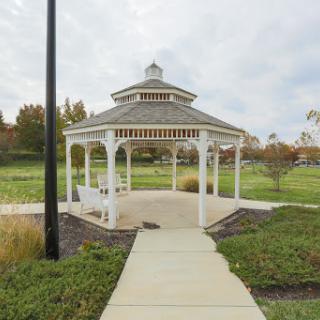 A charming gazebo in a serene park setting, inviting visitors to relax and enjoy the outdoors.