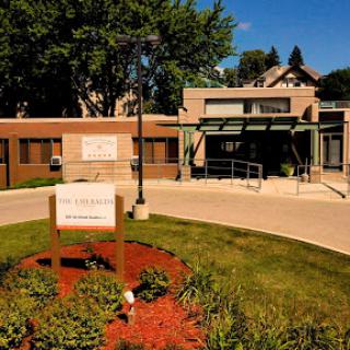A welcoming community center featuring a modern design and well-maintained landscaping.