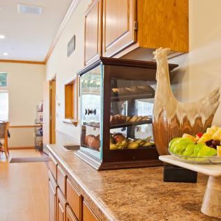 A kitchen counter adorned with a fruit bowl and decorative items.