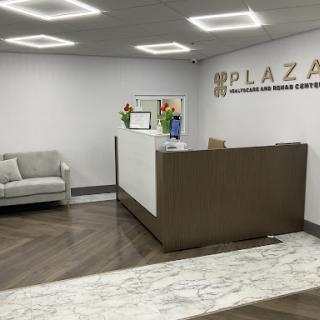 A modern reception area featuring a sleek desk and comfortable seating.