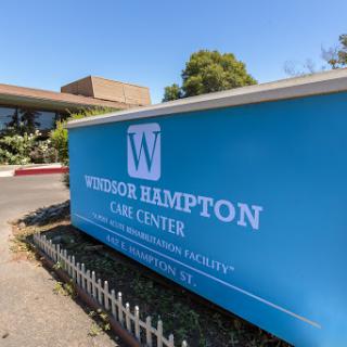 The entrance sign of Windsor Hampton One Center, a healthcare facility, showcasing a modern design.