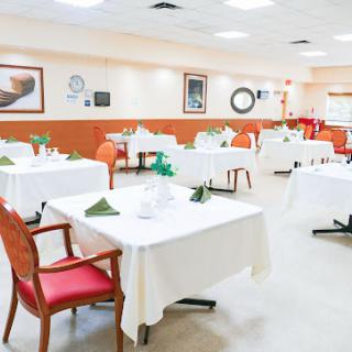 A well-arranged dining area with neatly set tables and a warm ambiance.