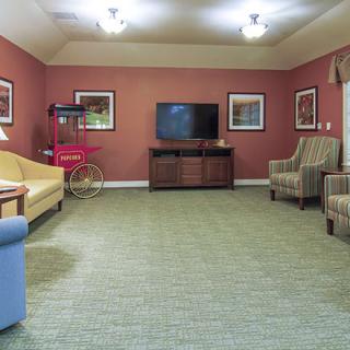 A cozy living room with comfortable seating, a television, and stylish decor.
