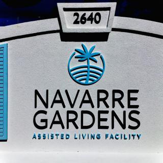 Sign for Navarre Gardens Assisted Living Facility with address number 2640.