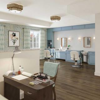 A modern and spacious beauty salon interior with elegant furnishings.