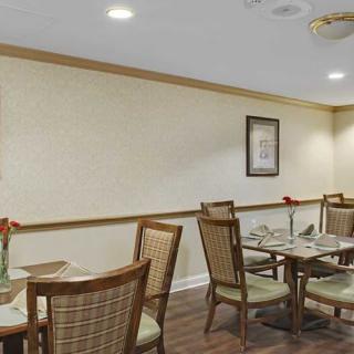 An inviting dining area with neatly arranged tables and chairs.