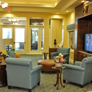 A cozy living room with comfortable seating and a television.