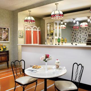 A vintage-style diner interior with retro furniture and decor.