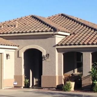 A suburban house with a tiled roof and a well-maintained exterior.