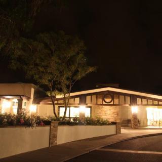 Exterior view of a building illuminated at night.