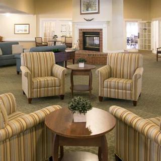 A cozy living room with comfortable seating and elegant decor.