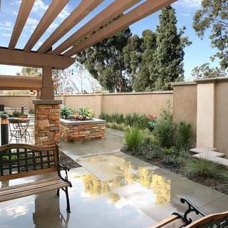 Beautiful outdoor patio area with a pergola and well-maintained garden.