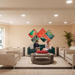 A modern living room with contemporary art and stylish furniture.