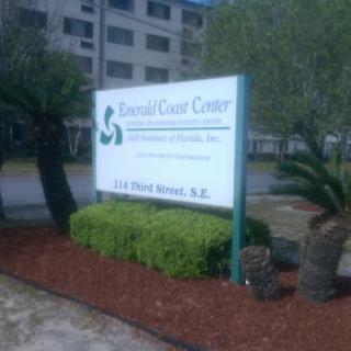 A sign for Ronald Court Center, a healthcare facility located on a landscaped property.