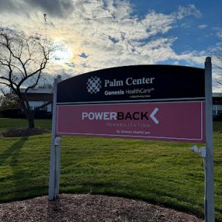 A sign for the Palm Center located at a healthcare facility, with the PowerBack program highlighted in a scenic outdoor setting.