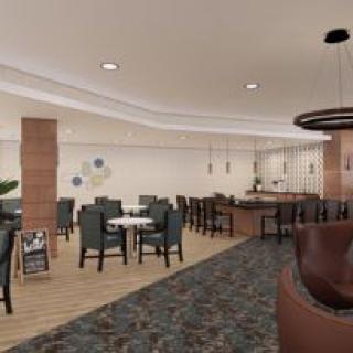 Modern restaurant interior with dining area and bar.
