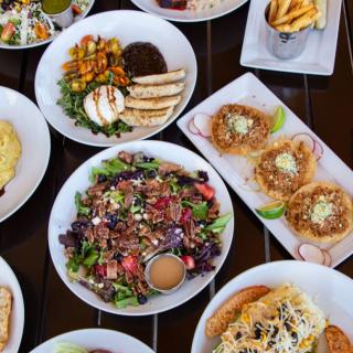 A diverse spread of delicious dishes, including salads and appetizers.