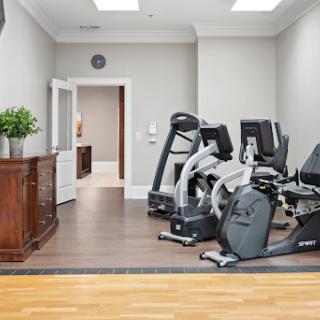 A well-equipped home gym featuring modern exercise machines and a stylish interior.