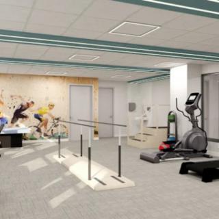 A well-equipped rehabilitation and physical therapy room with various exercise machines.