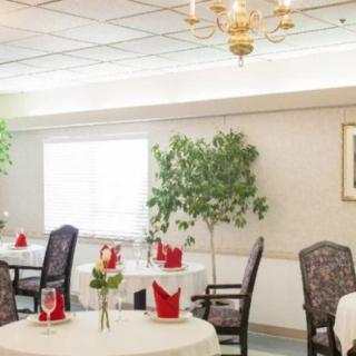 A well-decorated restaurant dining area with tables set for guests.