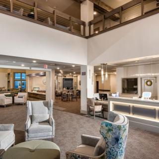Modern lobby area with comfortable seating and a reception desk.