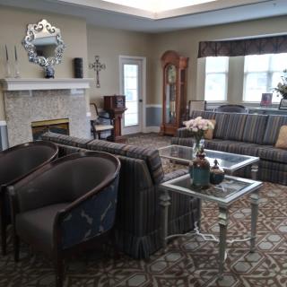 A cozy and elegant living room with classic furniture and decor.
