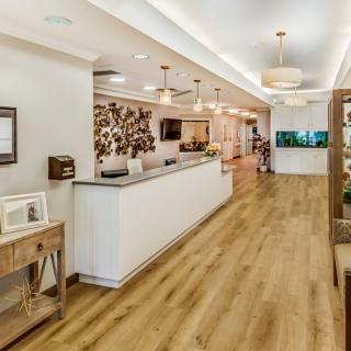 A modern reception area with wood flooring and stylish decor.