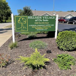 Welcome sign of Hillside Village of De Soto, highlighting its focus on community and healthcare.