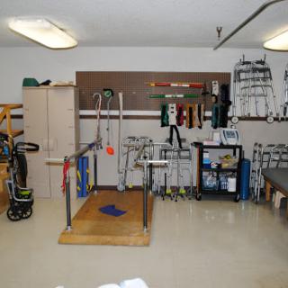 A well-equipped physical therapy room featuring various rehabilitation tools and equipment.