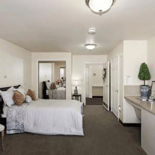 A modern and cozy bedroom with elegant interior design.
