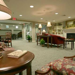 A cozy lobby with comfortable seating and warm lighting.