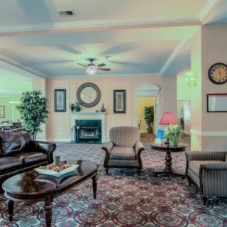 A cozy living room with plush seating and elegant decor.
