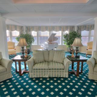 A spacious living room with comfortable seating and elegant decor.
