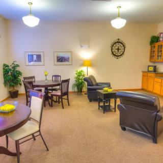A cozy living room with comfortable seating and warm lighting.