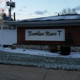 The entrance to Brunswick Manor, surrounded by a light dusting of snow.