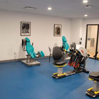 An indoor fitness center equipped with various exercise machines.