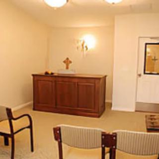 A small chapel with an altar and seating.